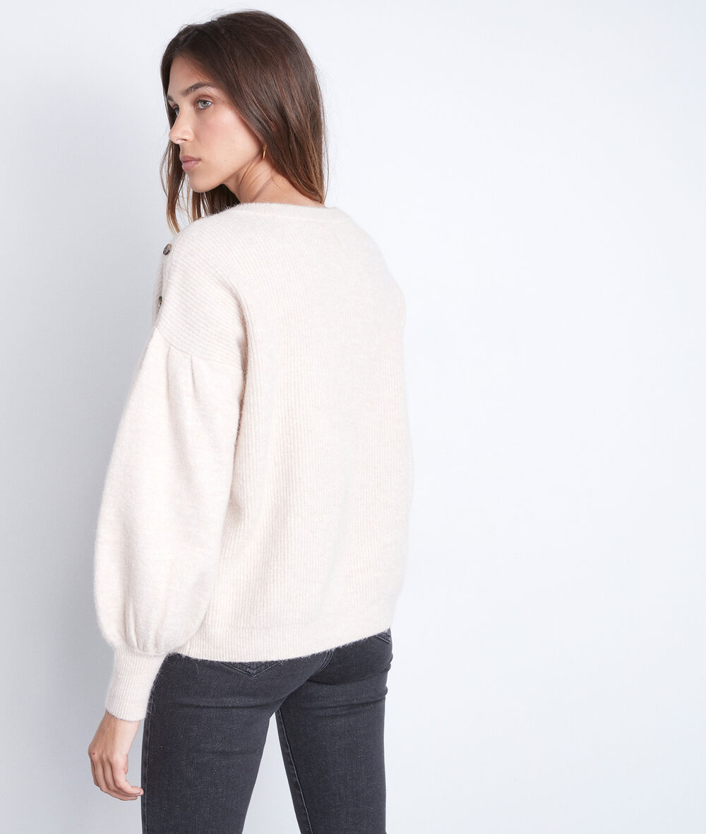 Pull terry beige manches bouffantes beige clair.