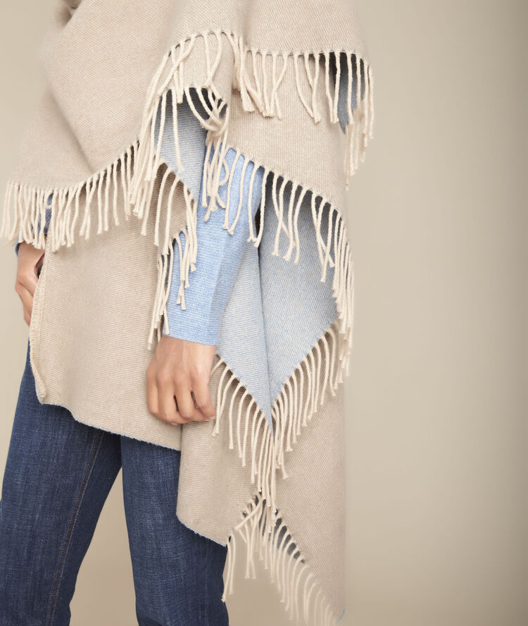 Poncho à franges grizzli bleu ciel.