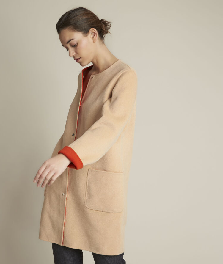 Manteau en laine r&eacute;versible saelle orange vif.