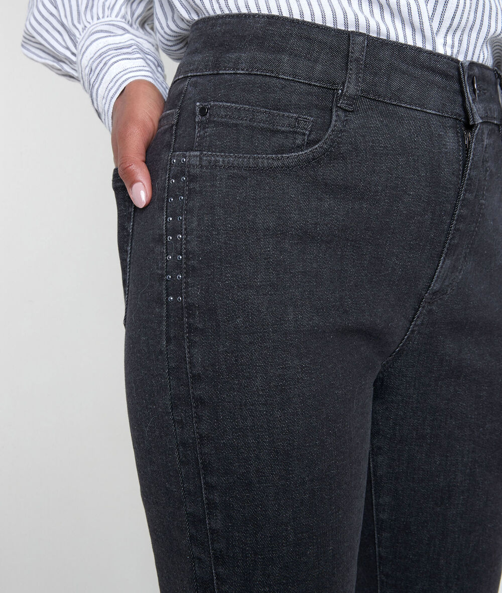 L'iconique slim jean noir à studs canelle noir.