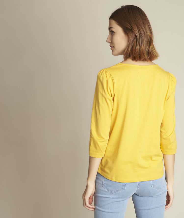Tee-shirt boutonn&eacute; jaune rosace miel.