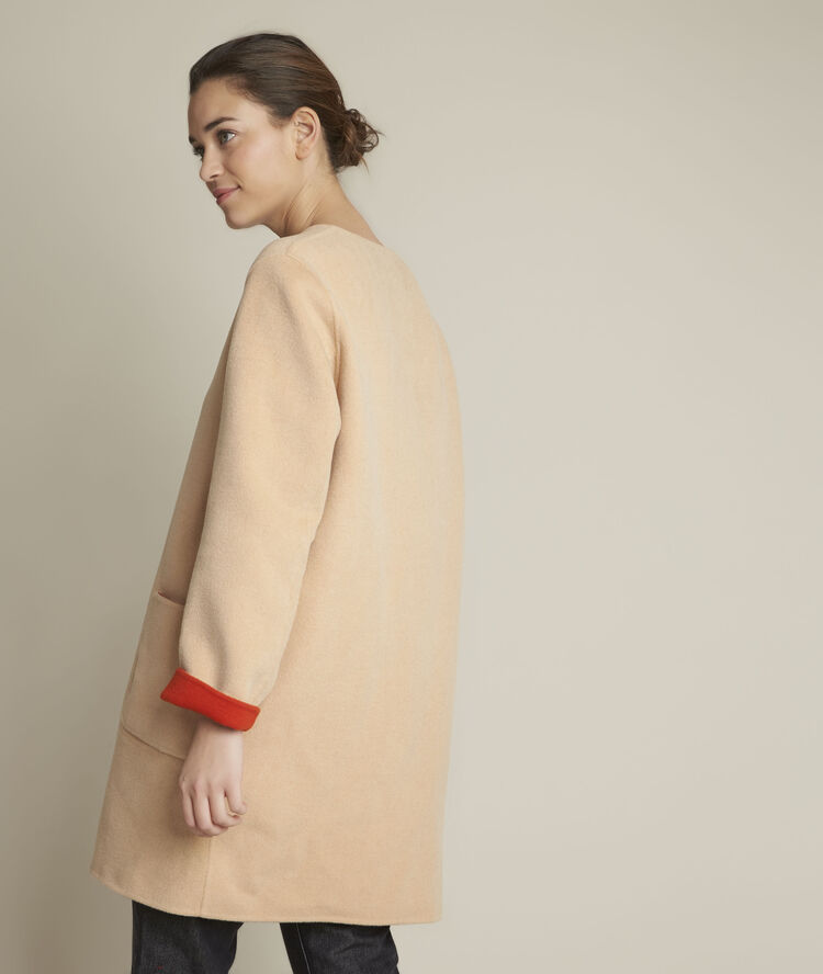 Manteau en laine réversible saelle orange vif.
