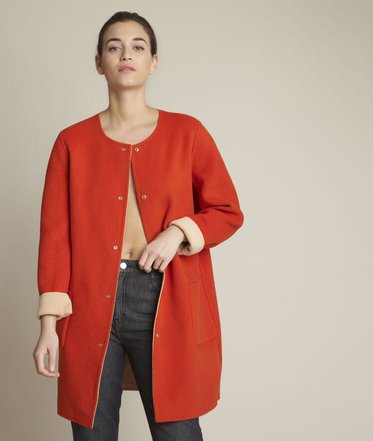 Manteau en laine r&eacute;versible saelle orange vif.