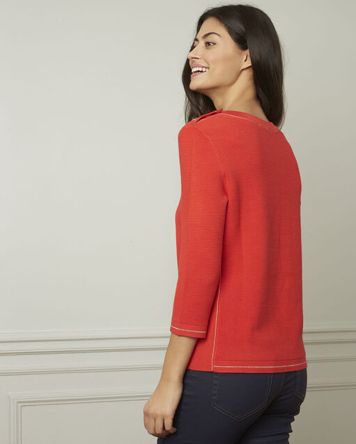 Roter pulli mit knöpfen und lurex avocado geranie.