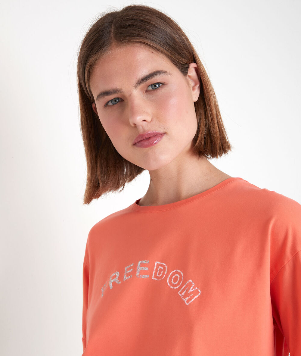 Tee-shirt en coton biologique à message corail etincelle corail.